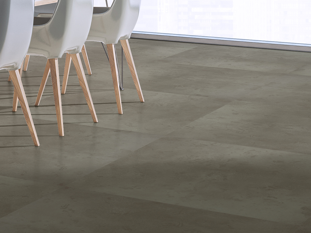 Select Pewter 36" x 36" concrete luxury vinyl tile installed in a commercial setting, featuring a smooth concrete-inspired visual with soft gray tones and subtle tonal variation.