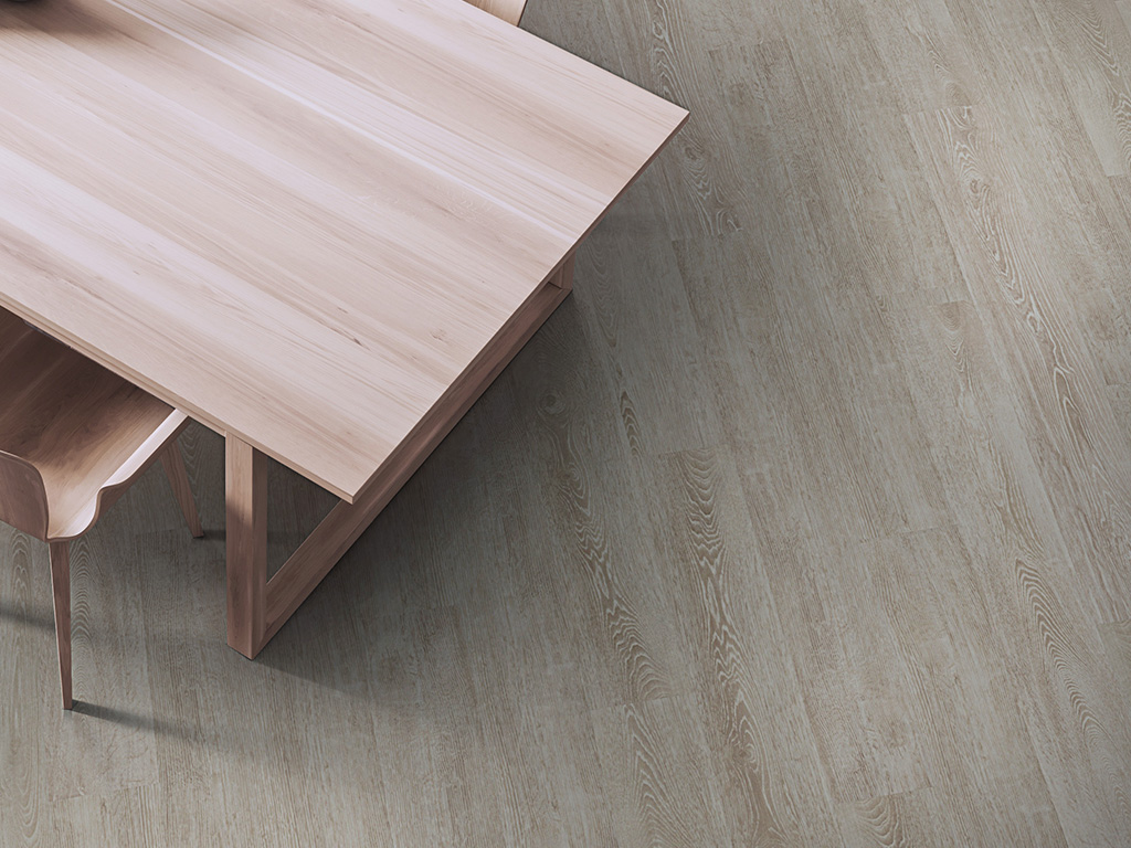 Select Arabian luxury vinyl plank installed in a contemporary interior, featuring light greige oak tones and subtle wood grain detail.