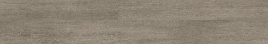 Gray wood look luxury vinyl plank in a random pattern. 