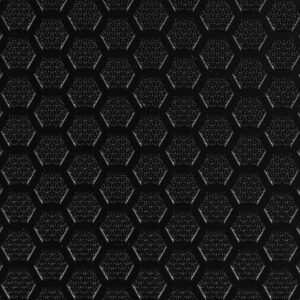 Close-up image of black vinyl sheet flooring featuring a raised hexagon tread pattern. The textured hexagonal surface enhances grip and adds a modern, geometric aesthetic, suitable for high-traction environments such as emergency vehicles and utility flooring applications.