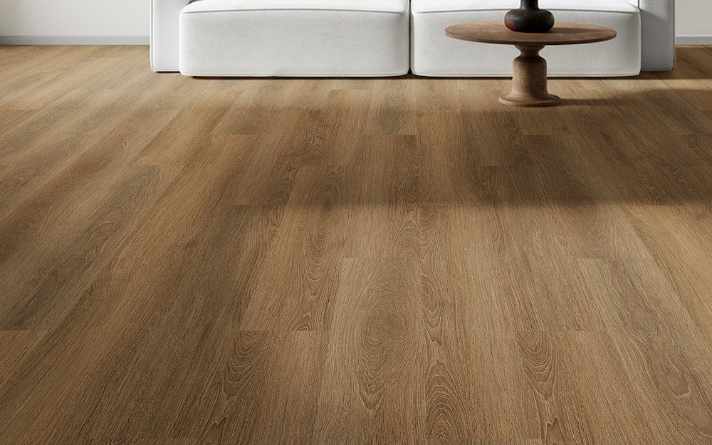 TAJ Wavelength Turbinado modular acoustic flooring, 5mm LVT, featuring a warm wood-look surface installed in a modern interior with a light sofa and round wood table.