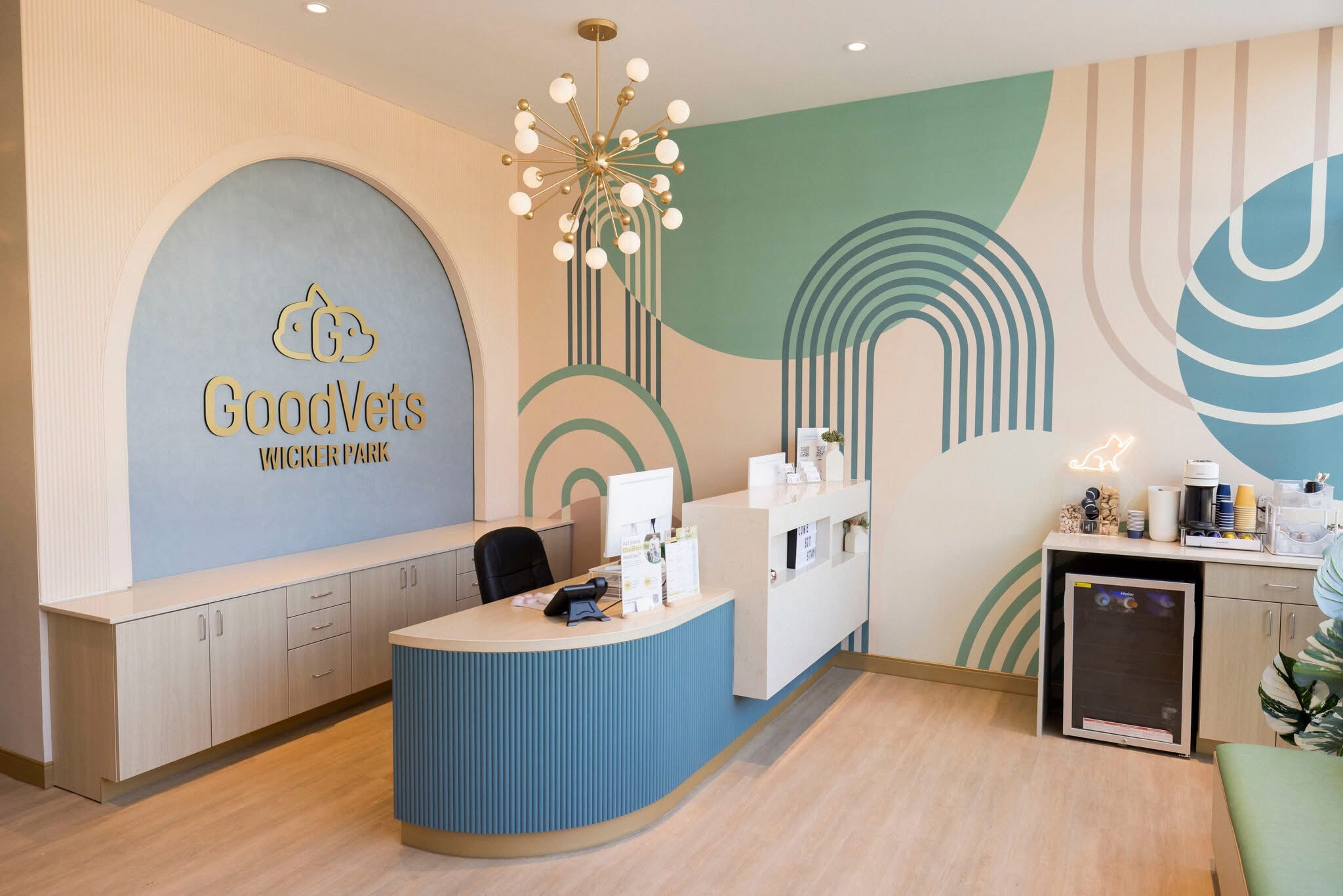 2-3-5 Luxury Vinyl Plank in Rift Honey installed in a modern veterinary clinic with curved walls, soft neutral tones, and a clean, welcoming reception area designed for high-traffic use