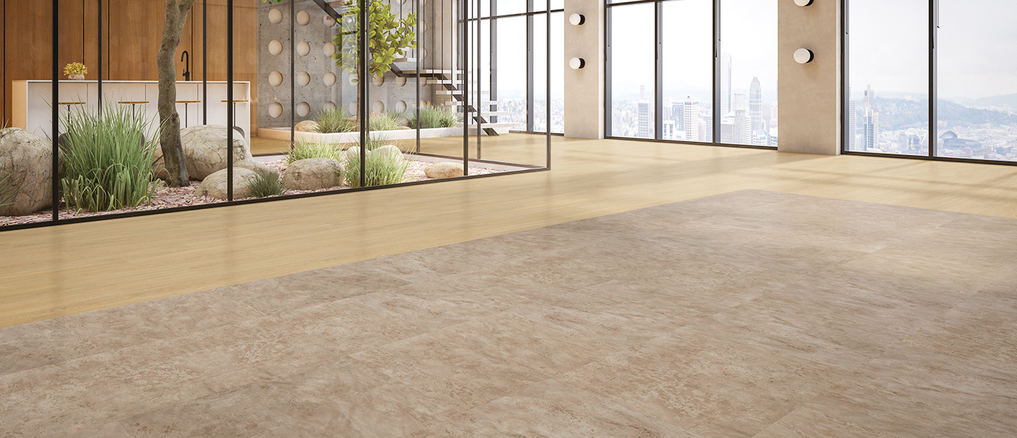 Modern commercial lobby featuring Select Cane luxury vinyl plank paired with Select Roma stone-look luxury vinyl tile, creating a warm mixed-material flooring design with wood accents, floor-to-ceiling windows, and an interior courtyard.